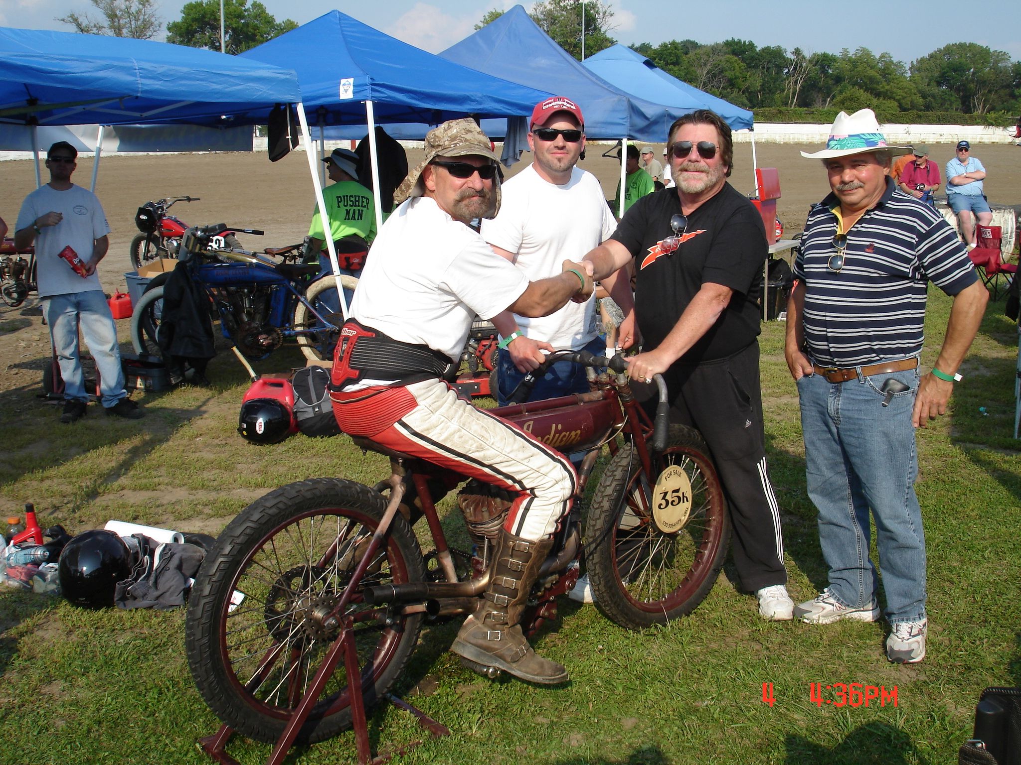 Vince Martenico (on bike), Sean Brayton, Dick Shappy, and Ray Belsito pose with Vince's 1920s Indian Twin.